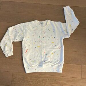 Suburban Riot white sweatshirt with paint splatters